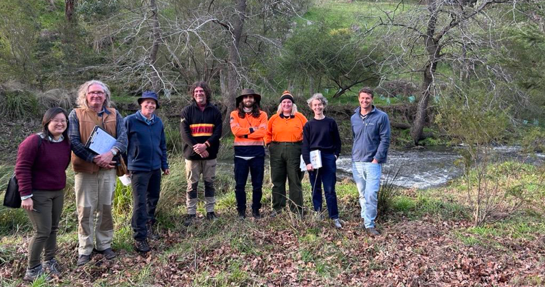 Narrap Rangers and Maribrynong FLOWS expert panel in forest posing for a line for photo